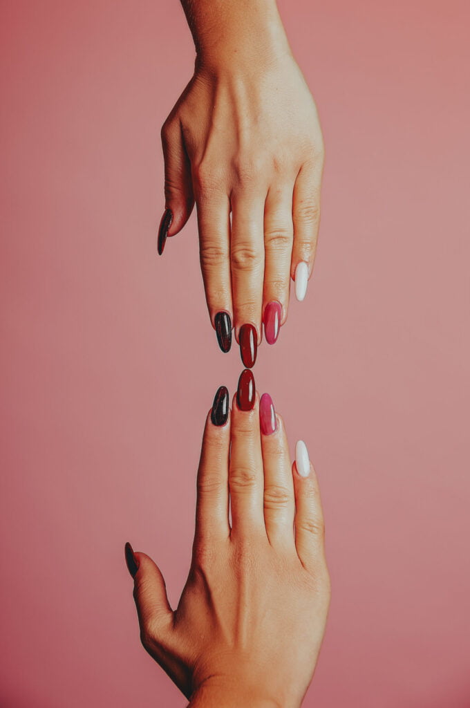 Professional nail designs on a dusty pink background